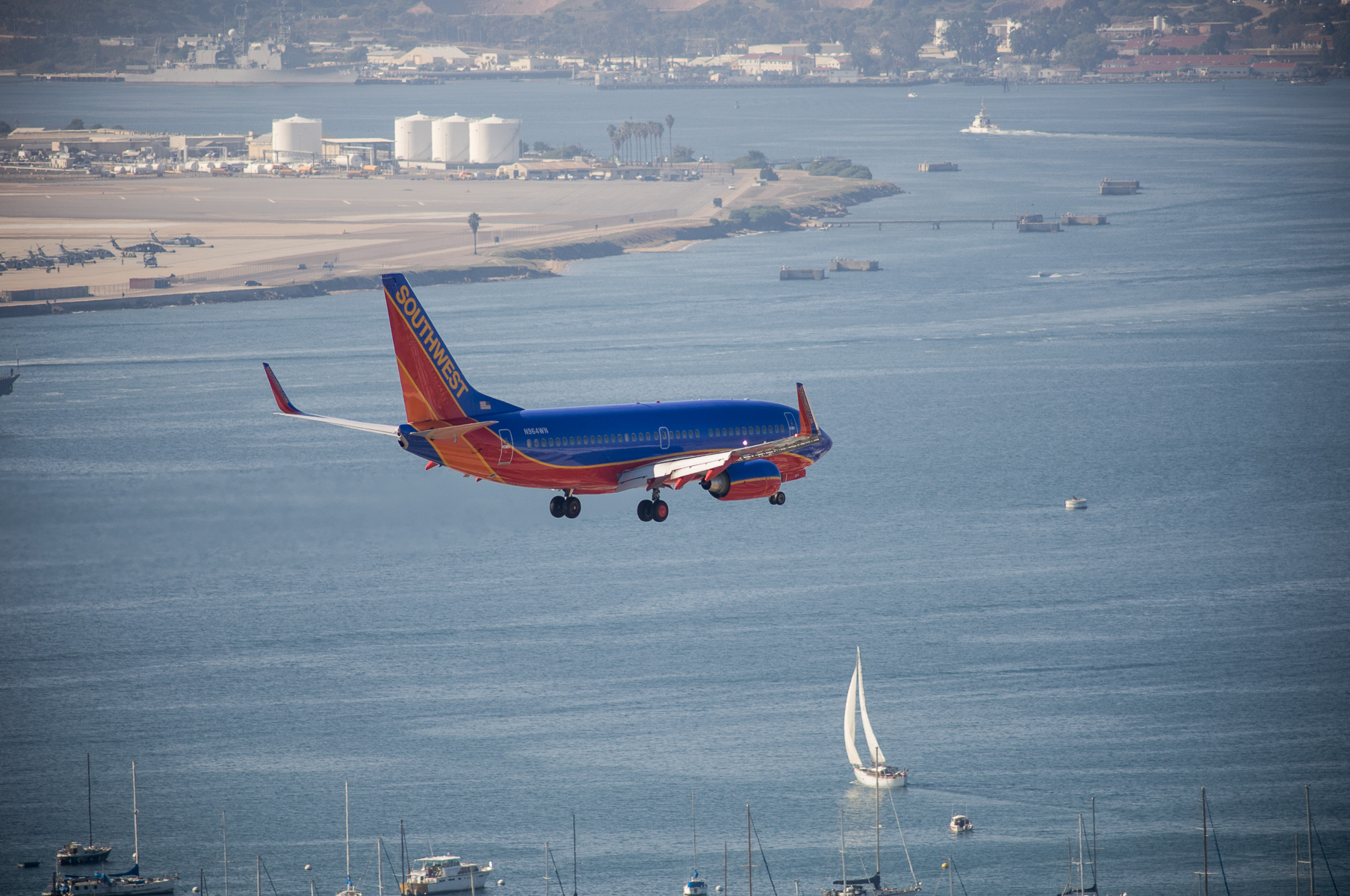 Southwest airplane lands over San Diego Bay
