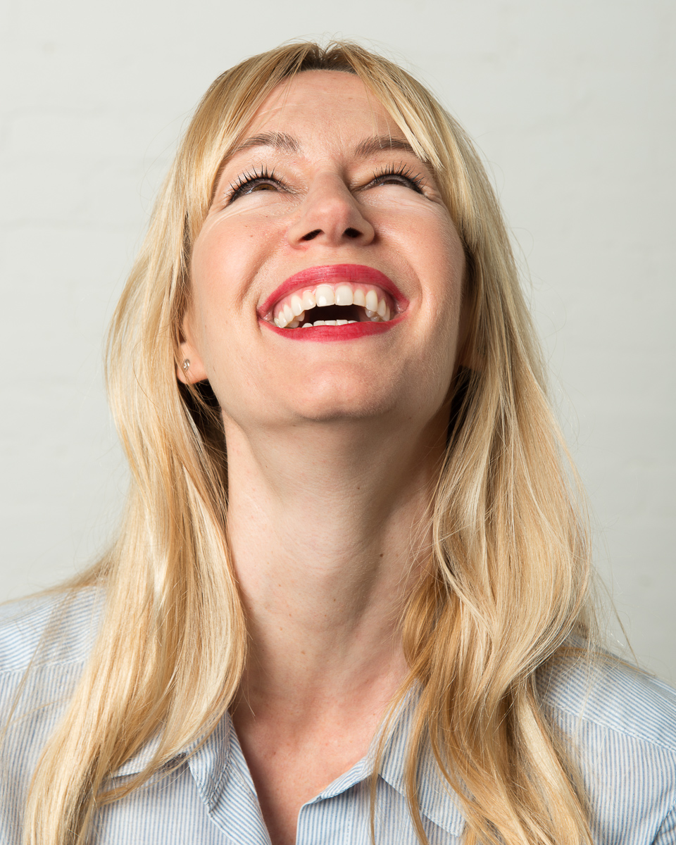 studio portrait of woman laughing