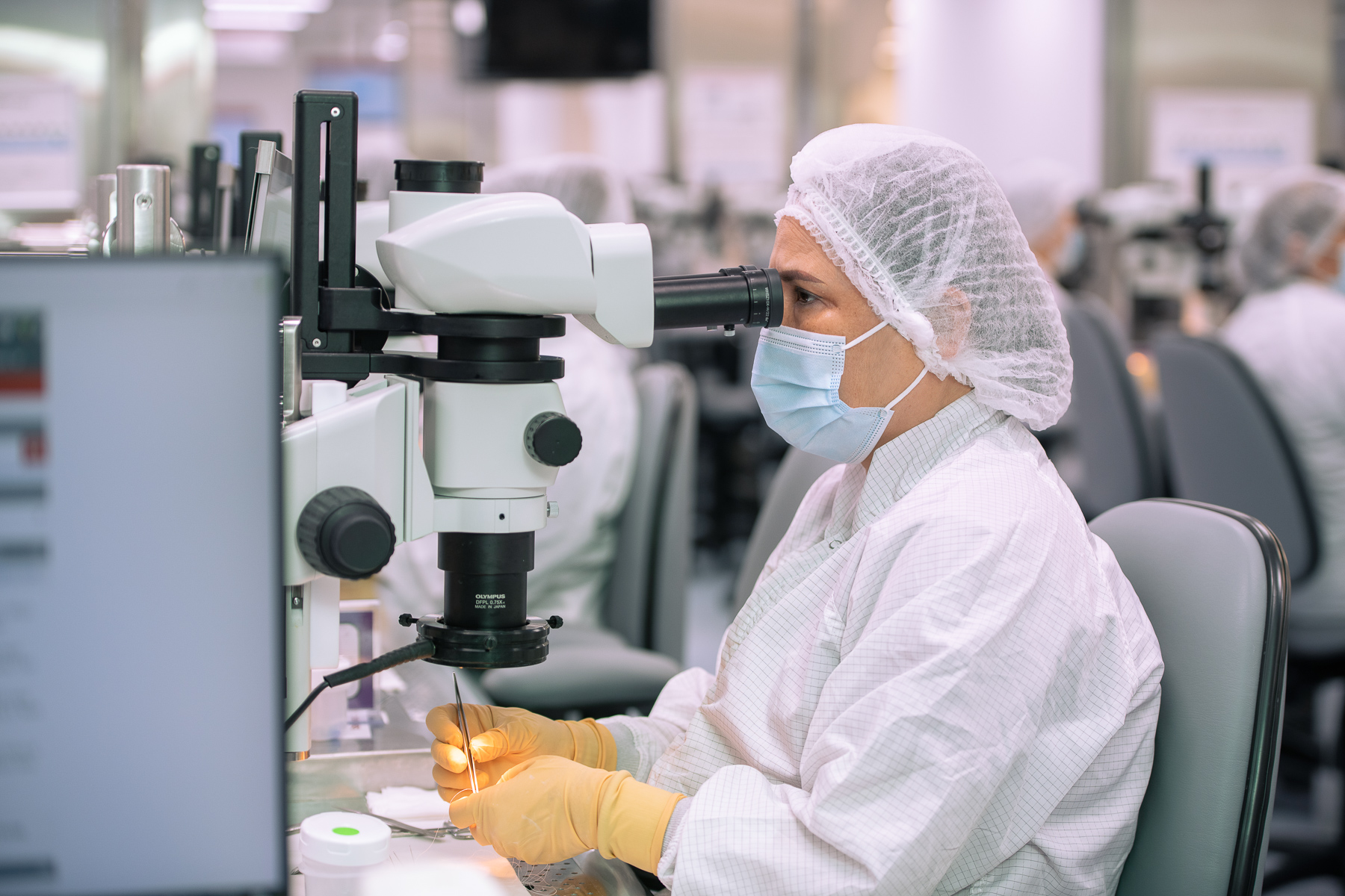Tech uses microscope to sew heart valve