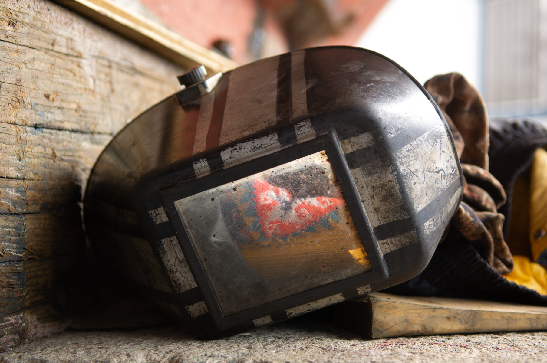 Welding mask on commercial industrial work site