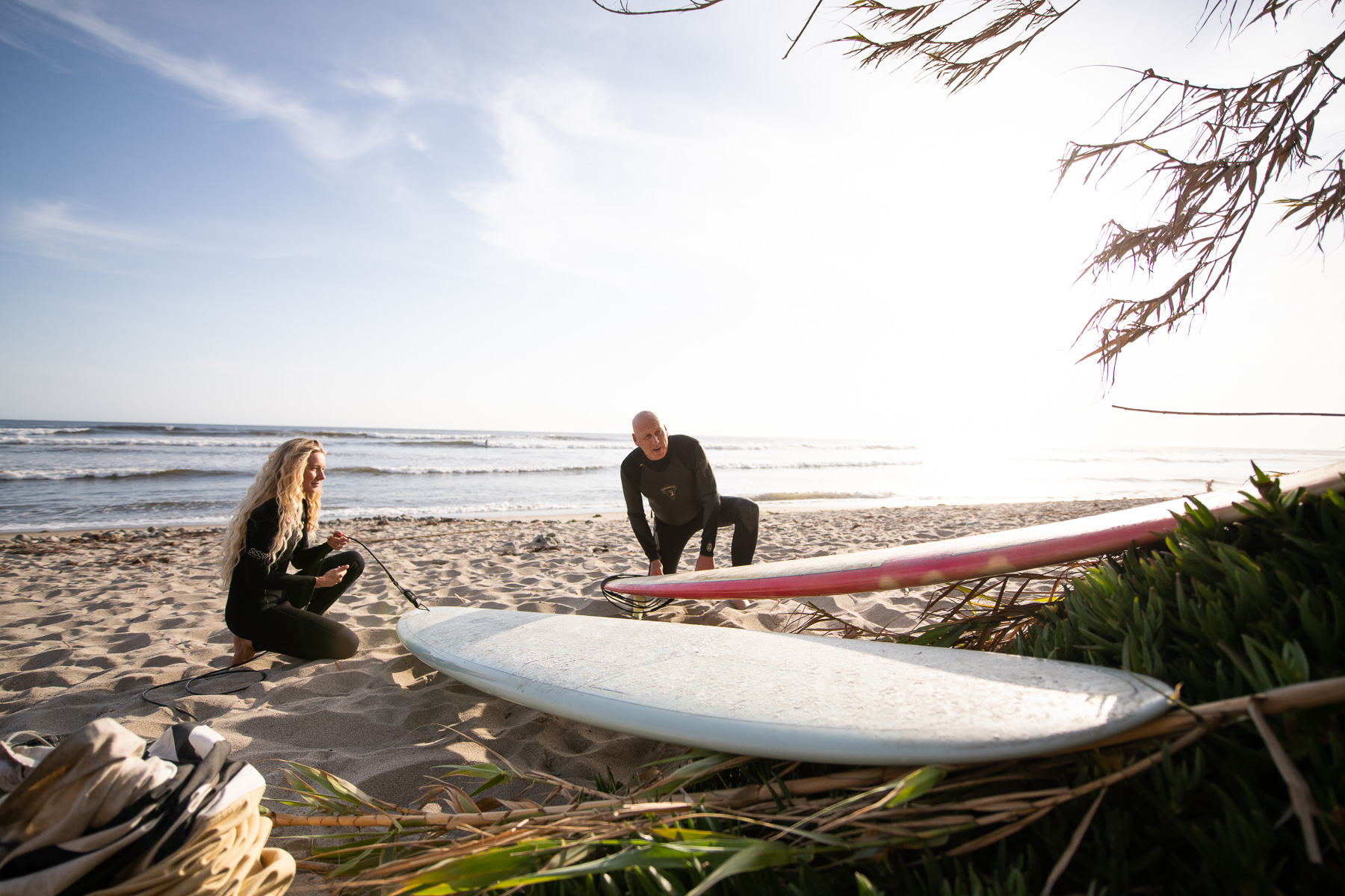 Father and daughter in law with longboard surfboards