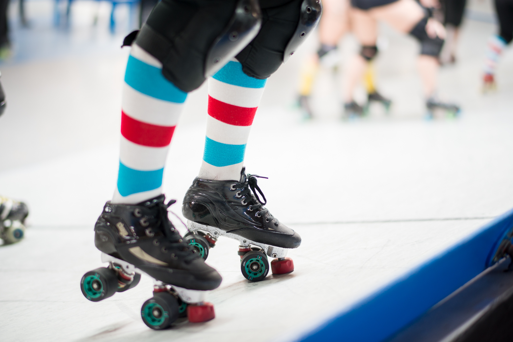 Roller derby skates on banked track